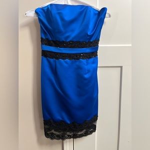 Andrew Adela: blue and black dress